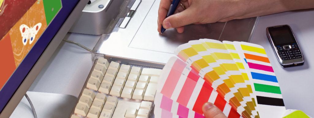 graphic artist selects colors for