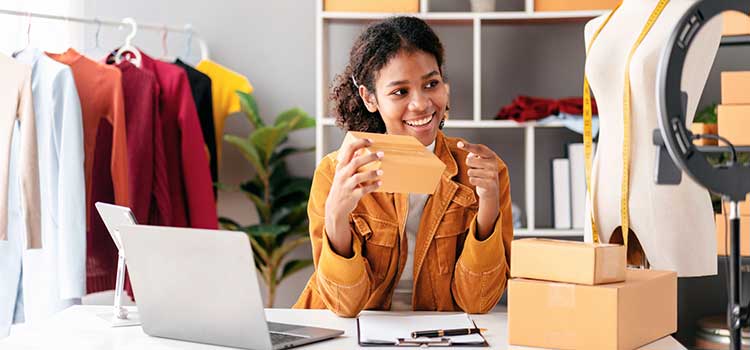 woman markets fashion products on cell video